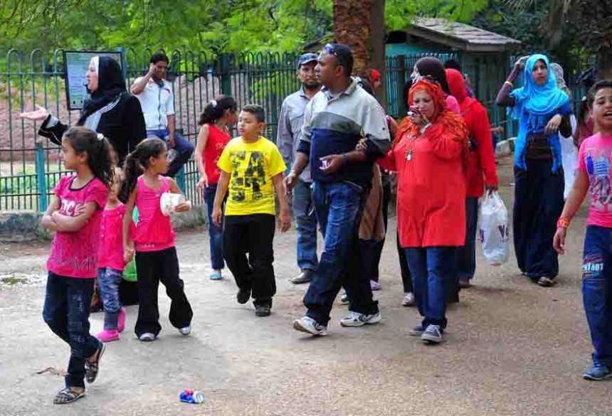Families take a walk in Giza zoo during celebrations for Eid Al-Adha (Photo by Hassan Ibrahim)