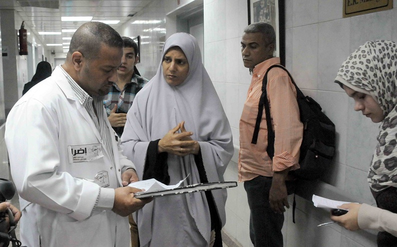Medical staff speak to patients at a Cairo hospital despite ongoing strike action Mohamed Omar