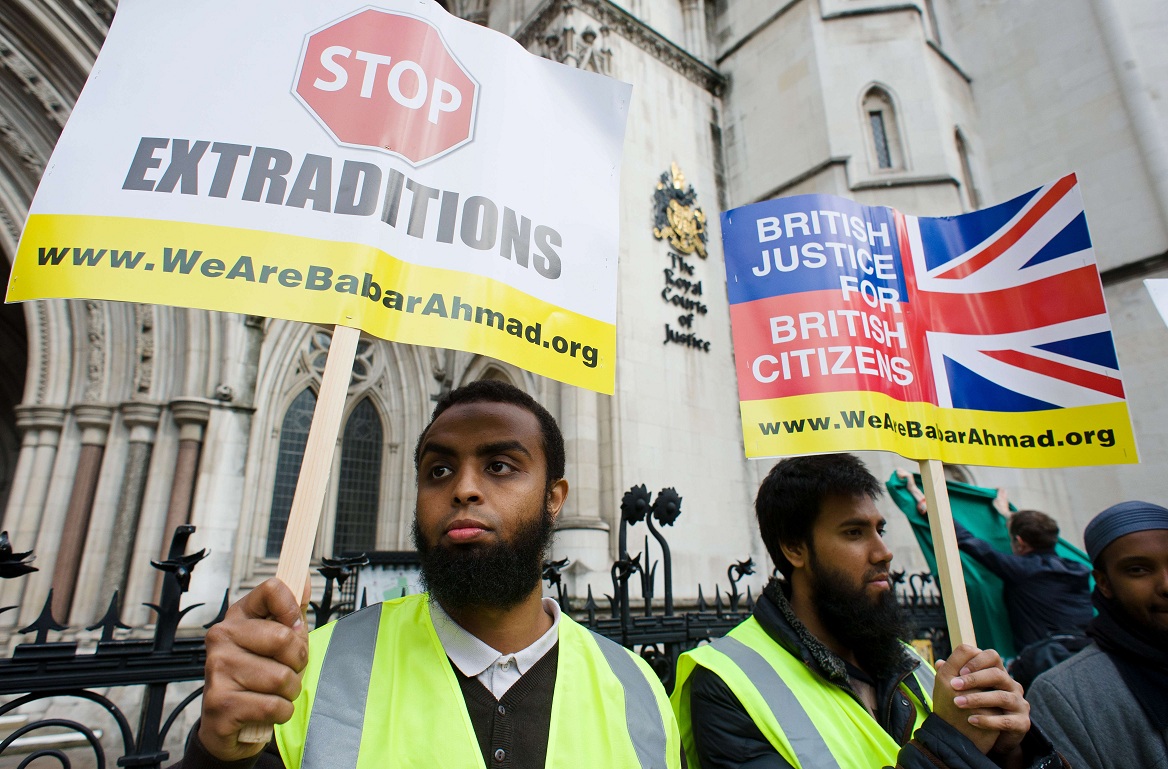 Protestors demonstrate in support of terror suspects Babar Ahmad and Syed Tahla Ahsan outside the High Court in central London AFP PHOTO / LEON NEAL