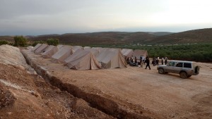 Syrian volunteers set up tents for refugees in the northwestern Syrian village of Qah  AFP PHOTO / HERVE BAR
