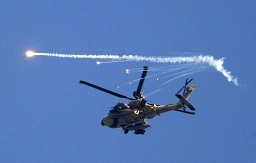 An Israeli helicopter drops flares over the Gaza Strip. (AFP File / Jack Guez)