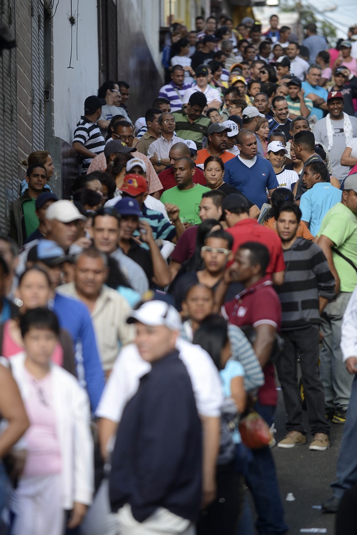 People queue at a polling station in the sprawling Petare slum, Caracas AFP PHOTO / LEO RAMIREZ
