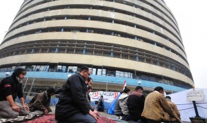 Protesters pray during a sit-in outside of the Maspero state media in January 2012 Hassan Ibrahim / DNE