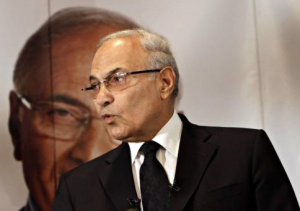 The Prosecutor General Tala’at Abdallah announced on Tuesday that he has asked the Office of International Cooperation to prepare a memorandum asking Interpol to arrest former presidential candidate Ahmed Shafiq. (AFP/File, Mohammed Abed)