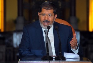 President Morsy thinks of the bank account as a method through which figures of the old regime would find it easier to return stolen funds (AFP PHOTO)