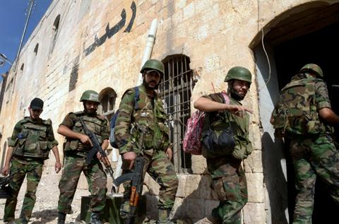 Syrian government forces patrol in the northern Syrian city of Aleppo on October 7, 2012. Aleppo was shaken by the heaviest fighting of an almost three-month offensive against rebels in Syria's second city, residents said, as the insurgents lost ground in the capital Damascus. AFP PHOTO/ STR