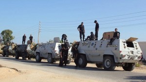 Egyptian security forces stand by their armoured personnel carriers ahead of a military operation in the northern Sinai Peninsula. (AFP PHOTO)