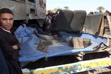 Wreckage of a school bus lies tangled with the train that crashed into it killing dozens of children. (DNE / MOHAMED OMAR)