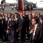 Egyptian Foreign Minister Mohamed Kamel Amr (Back, 3rd from right) welcomes Turkey's Prime Minister Recep Tayyip Erdogan (centre) and his wife Emine at Cairo airport .(AFP PHOTO / Stringer)