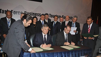 Hatim Salah, Minister of Industry and Foreign Trade, right, signs one of the EU-Egypt task force agreements. (PHOTO BY MOHAMED OMAR)