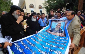 Worshippers present Bishop Tawadros with a new banner celebrating his ascension to the papacy Hassan Ibrahim 