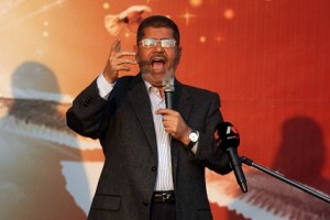 Mohamed Morsy addresses his supporters in front of the presidential palace in Cairo on Friday AFP PHOTO/STR