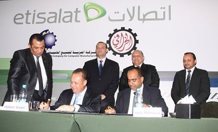 The signing of the partnership agreement between Etisalat Egypt and Kharafi's Arab Company for the Manufacture of Computers. (Photo courtesy of the Etisalat Egypt)