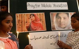 Pakistani Christians attend a prayer service for the recovery of schoolgirl activist Malala Yousafzai at a church in Lahore. (AFP PHOTO / ARIF ALI)