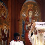 Egyptian caretaker of the Coptic Church Bishop Pachomius shows the ballot bearing the name of Bishop Tawadros in Arabic AFP PHOTO / MAHMUD KHALED
