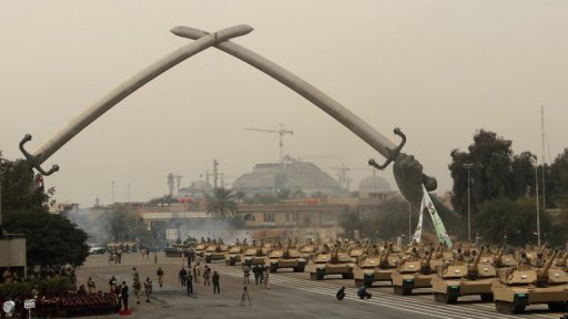 Iraqi army MIA1 Abrams tanks roll under the victory Arch landmark during an Army Day parade in Baghdad in January. (AFP PHOTO / ALI AL-SAADI)
