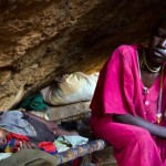 A mother and child rest in a cave in South Kordofan, Sudan. They are among thousands of civilians sheltering from aerial bombing. (AFP / GETTY IMAGES)