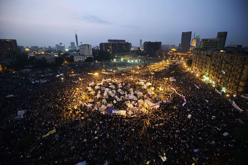 Tens of thousands people take part in a mass rally in Tahrir Square against the decree by President Morsy. The planned demonstrations came a day after Morsy stuck by his controversial decree in a meeting with judges that was aimed at defusing the worst political crisis since his election in June AFP Photo / Gianluigi Guercia