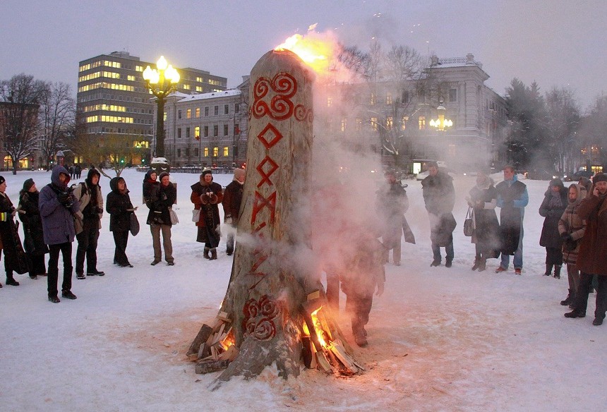 People participate in winter solstice celebrations to complete the Christmas 'Blukis' (stump) burning ceremony at Lukiskes Square in Vilnius. The pagan traditions in Lithuania include a popular myth of stealing and conquering the Sun. To free the Sun the Blukis is dragged around a town, beat and later burned. AFP Photo / Petras Malukas