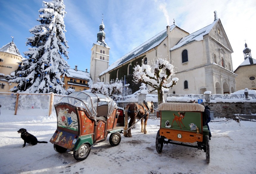 Horse-drawn carriages wait for clients in the French ski resort of Megeve. AFP Photo / Jean-Pierre Clatot