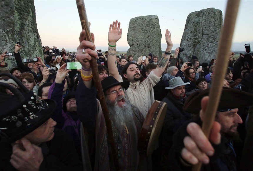 People celebrate winter solstice on the shortest day of the year at the famous historic stone circle of Stonehenge in Wiltshire, England. AFP Photo / Matt Cardy