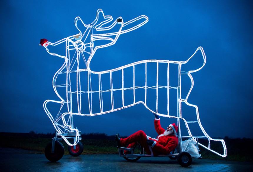 German bicycle designer Didi Senft known during the Tour de France as "El Diabolo” presents his latest Christmas-themed construction in Storkow. AFP Photo / Patrick Pleul