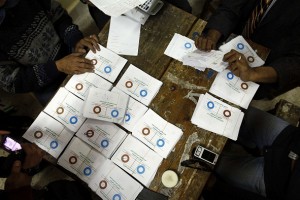 Polling station officials count ballots in Cairo on 15 December 2012. (DNE/ Hassan Ibrahim) 