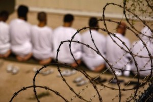 A group of detainees kneels in prayer at the US military prison in 2009 in Guantanamo Bay, Cuba. (Getty Images/AFP/File, John Moore)
