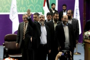 Hamas chief-in-exile Khaled Meshaal (centre) waves at supporters during a visit to the Islamic University in Gaza City   (AFP File Photo/ Mahmud Hams)