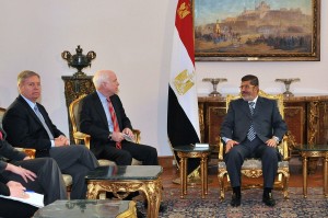 President Mohamed Morsy meeting with United States senator John McCain at the presidential palace in Cairo(Egyptian Presidency handout photo)