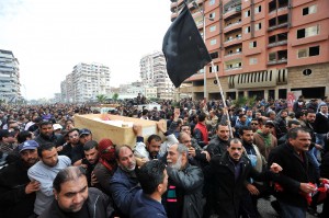 Egyptian mourners carry the coffins of people killed in clashes the day before during a funeral procession in Port Said. (AFP Photo / Stringer)