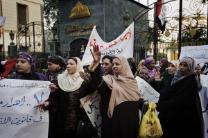 Egyptian women demonstrate in front of the Shura Assembly against the new election law while demanding more rights for minority groups. (AFP Photo / Gianluigi Guercia)