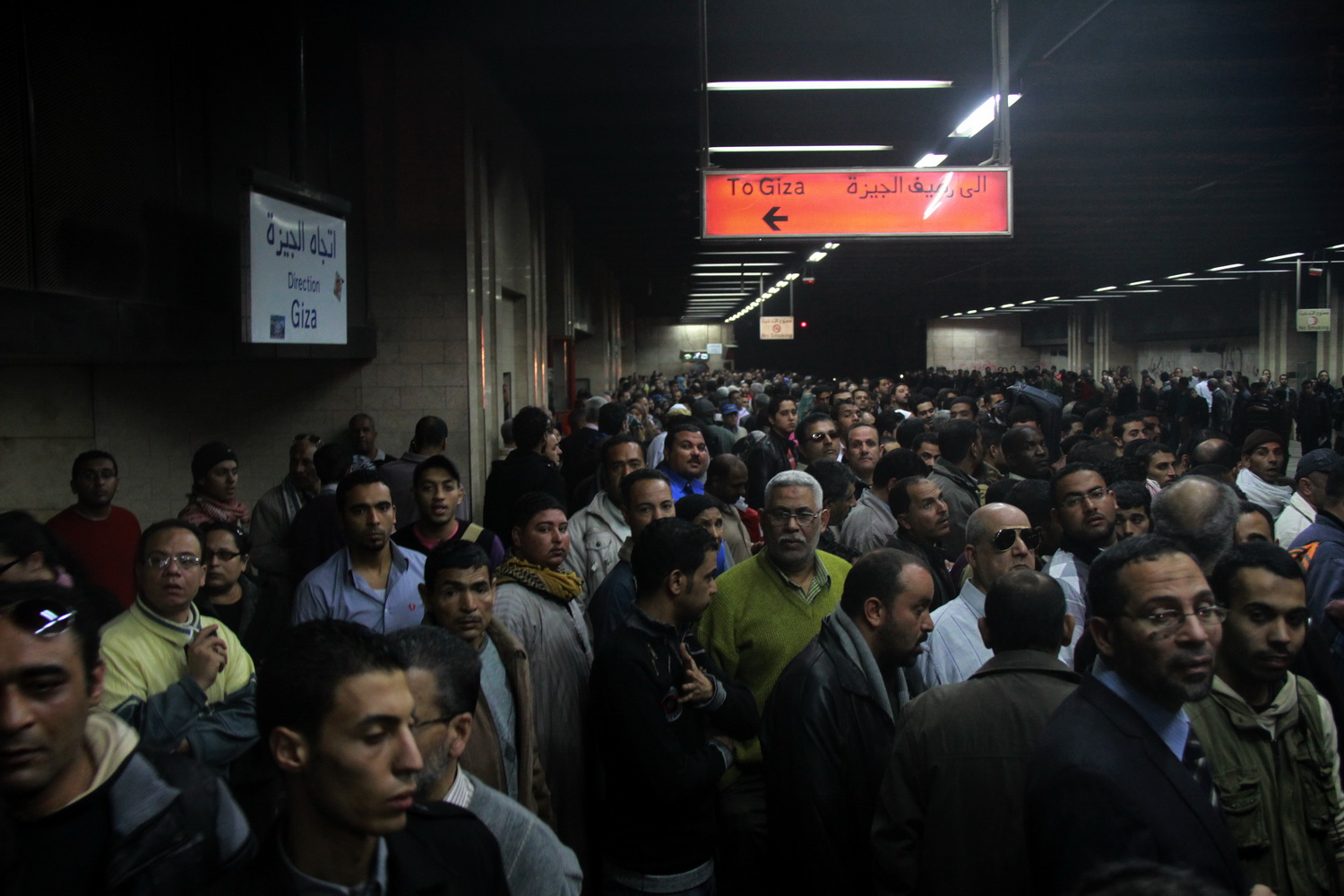 People wai for the metro at Saad Zaglhoul station that was earlier blocked by Ultras groups . By: Ahmed Al-Malky