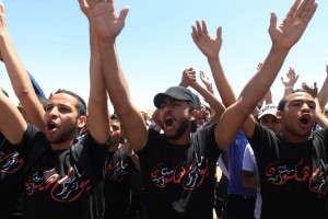 Egyptian Al-Ahly club fans gather outside the Police Academy on the outskirts of Cairo in April 2012 during the trial of officials and rioters arrested after the Port Said stadium deaths AFP Photo / Khaled Desouki