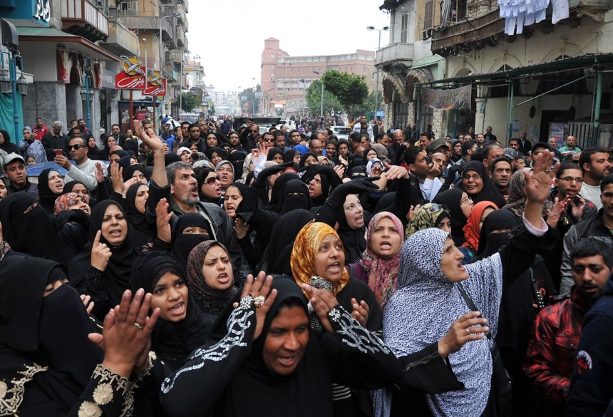 Egyptian women march in the streets of the canal city of Port Said on 29 January AFP Photo / Stringer
