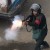 An Egyptian police officer fire tear gas at demonstrators in Cairo AFP Photo / Khaled Desouki