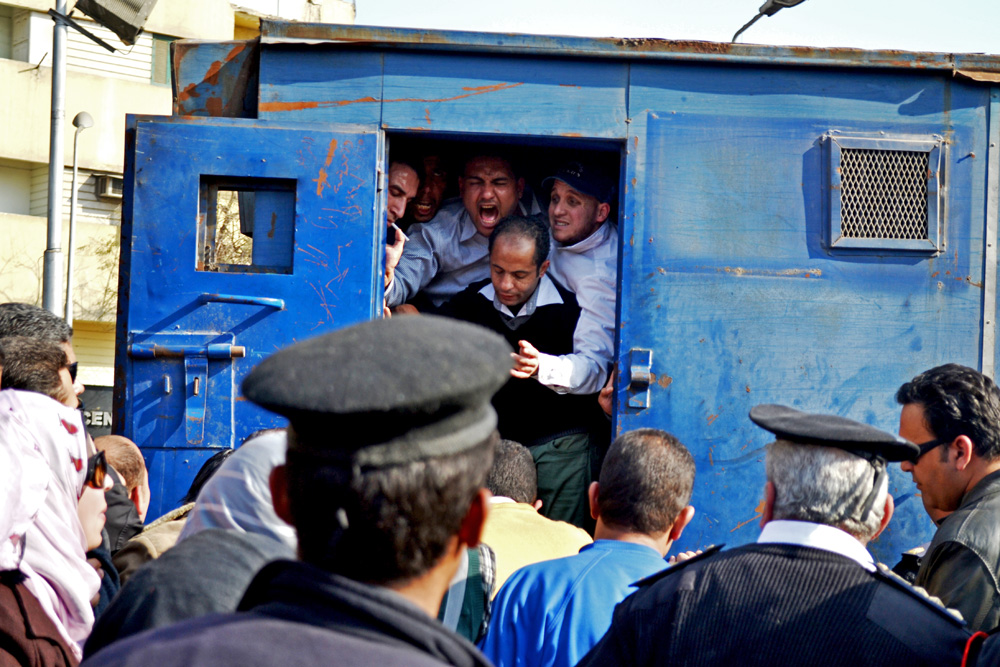 Security forces arrest protesters demonstrating near the house of Prime Minister Hesham Qandil Photo by Mohamed Omar