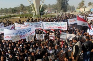 Protesters gather in support of Prime Minister Nuri al-Maliki in the central Iraqi city of Diwaniyah, 160 kilometres (100 miles) south of Baghdad, on 8 January 2013. 
