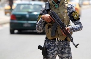 An Iraqi policeman stands guard at a checkpoint in central Baghdad on July 24, 2012 (AFP/File, Ahmad al-Rubaye)