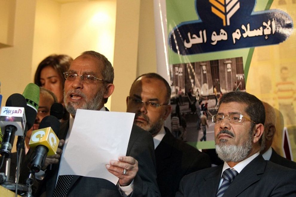 Mohammed Badie, the head of Egypt's Muslim Brotherhood, speaks at a press conference alongside Mohamed Morsy (AFP Photo / Khaled Desouki)