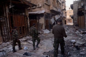 Syrian government forces walk through Aleppo's old souk on January 3, 2012, after they allegedly recaptured the area (AFP)