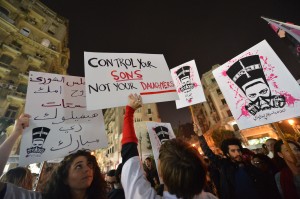 Egyptian protesters hold up placards and shout slogans during a demonstration in Cairo against sexual harassment on February 12, 2013. Egyptian protesters took to the street again to demand an end to sexual violence, as campaigns against the repeated attacks in central Cairo pick up steam. Sexual harassment has long been a problem in Egypt, but recently the violent nature and frequency of the attacks have raised the alarm.   AFP PHOTO / KHALED DESOUKI