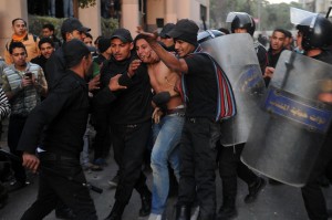 Protester being arrested on 30 January 2013. Arrests have continued until the early hours of 2 February 2013 (Photo by Mohamed Omar/DNE)