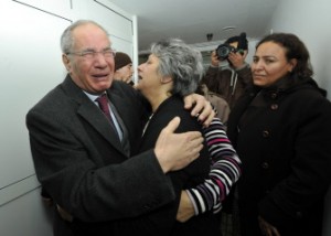 Human rights activist and lawyer Mokhtar Trifi (L) and Basma Choukri (C), the wife of assassinated Tunisian opposition leader and outspoken government critic Chokri Belaid, mourn over the latter's death (AFP Photo)