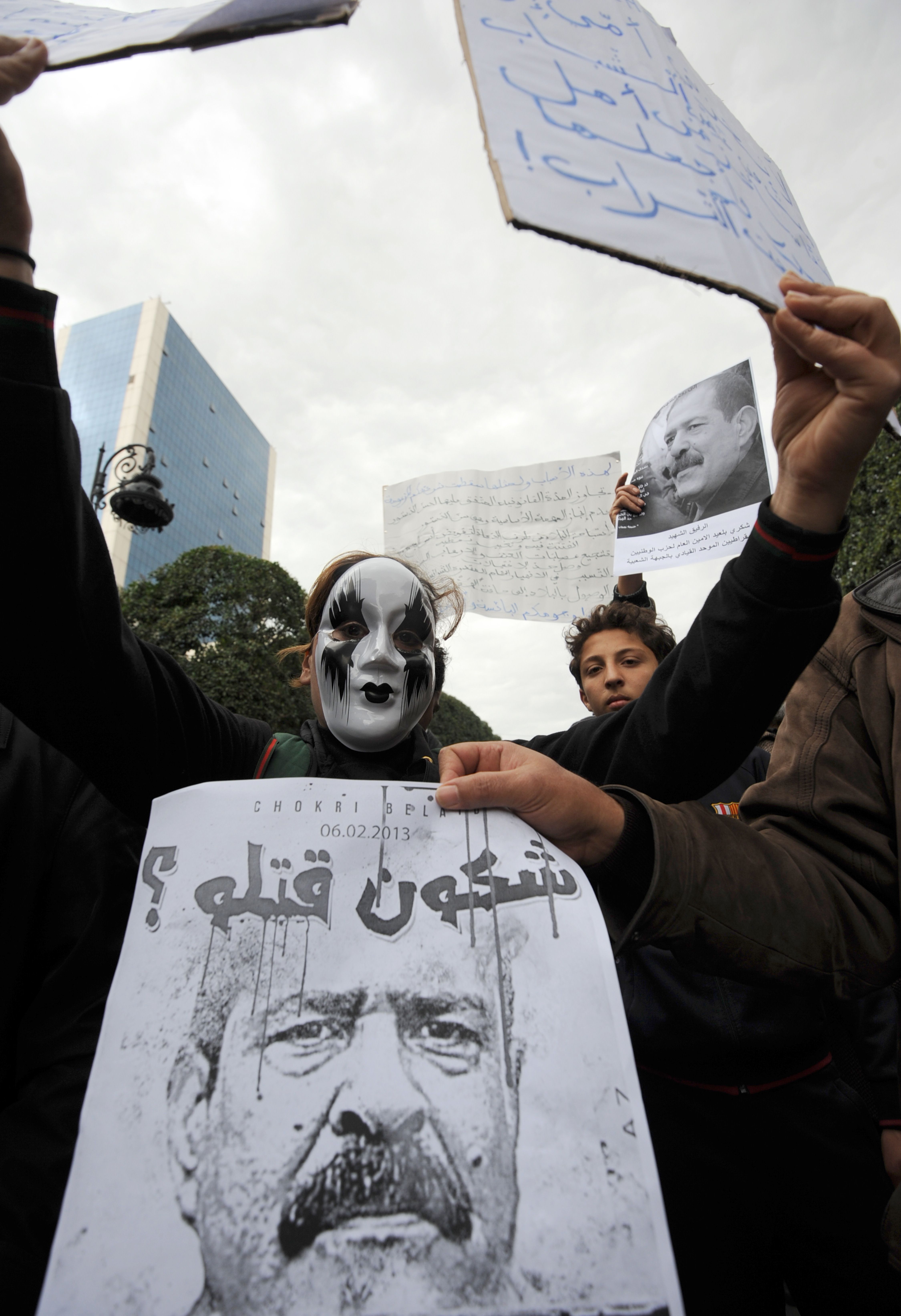 Hundreds of demonstrators marched to protest against the Islamist party Ennahda in power, and demanded that Belaid's killers be found. (AFP Photo)