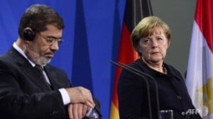 German Chancellor Angela Merkel and President Mohamed Morsi give a joint press conference following a meeting at the Chancellery in Berlin at the end of January  AFP Photo /John Macdougall