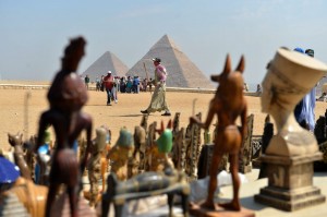 TourismAn Egyptian camel owner waits for customers as tourists visit the Giza pyramids, south of CairoAFP Photo / Khaled Desouki