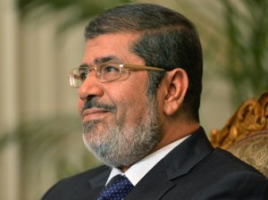 In response to questions on whether the Muslim Brotherhood influences his presidential decisions, Morsi said that his “background with the Brotherhood is part of my psychology, humanity and belief”. (AFP Photo)