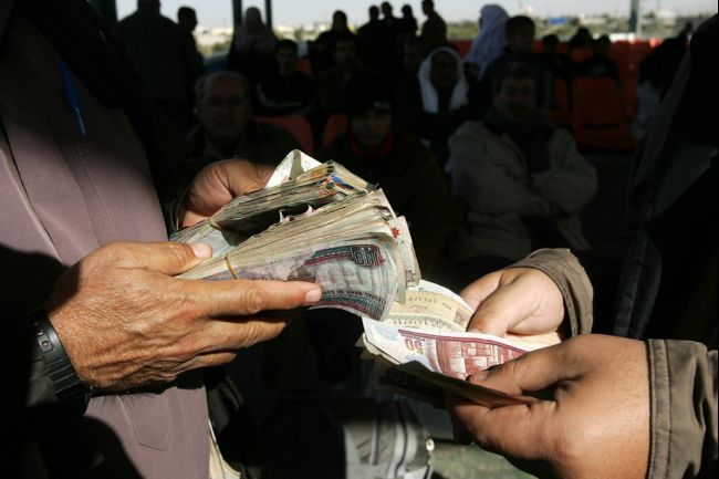 The report said in Egypt, optimism for local job prospects lowered by nine points in Q4 to 50% and positive perceptions for personal finances dropped seven points to 57% ( Photo - AFP)