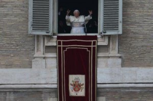 Pope Benedict XVI gestures as he appears at the balcony to celebrate his last Sunday prayers before stepping down on February 24, 2013 at St Peter's Square in Vatican city. (AFP\Photo)